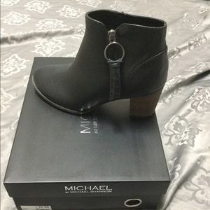 Black booties. Faux leather.